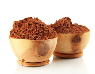 Cocoa powder in wooden bowls, isolated on white