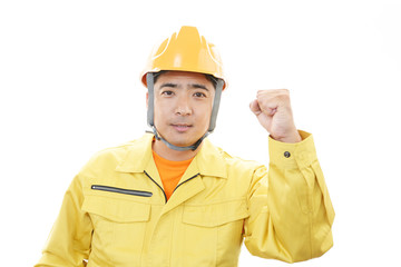 ガッツポーズの作業員