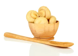 Fotobehang Mushrooms in wooden bowl, isolated on white © Africa Studio
