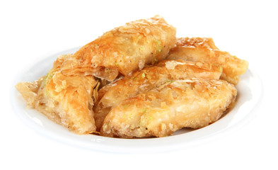 Sweet baklava on plate isolated on white