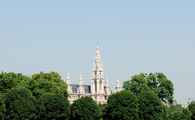 Fototapeta premium Vienna City Hall beyond the trees in Heldenplatz, Austria