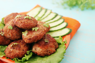 cutlets with cucumber and watercress