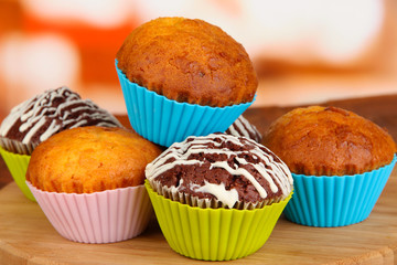 Sweet cupcakes on wooden table