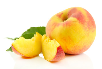 Ripe sweet peach with leaves, isolated on white