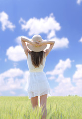 Portrait of beautiful young woman in the field