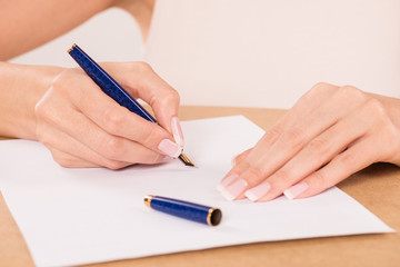 hand with fountain pen