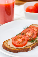 Fresh pate on bread with tomatoes