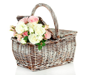 Fototapeta na wymiar Picnic basket with flowers, isolated on white