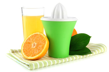 Citrus press, glass of juice and ripe oranges, isolated on