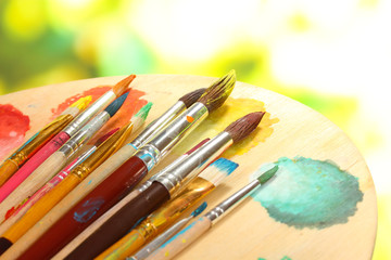 Many brush in paint close-up