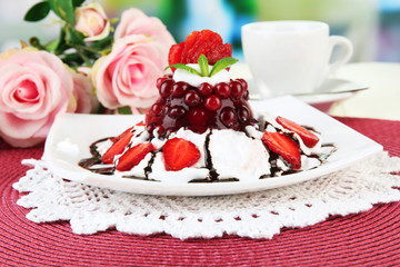 Tasty jelly dessert with fresh berries, on bright background