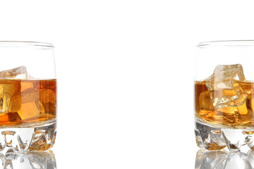 Brandy glasses with ice isolated on white