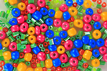 Different colorful beads close-up