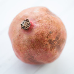Ripe pomegranate, close-up, studio shot