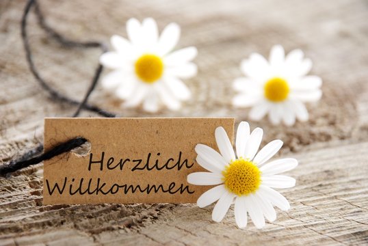 natural looking label with herzlich willkommen