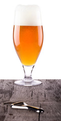 Beer glass on wooden table background