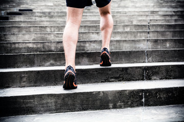 Fototapeta na wymiar Jogger running on stairs, sports training