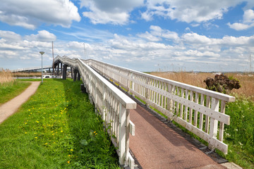 Fototapeta na wymiar long white bridge over river, Alkmaar
