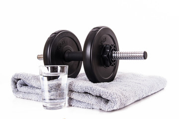Black Barbell, Towel and Glass of Water