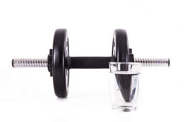 Glass of Water and Black Barbell