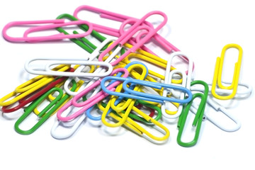 colorful paper clips on white
