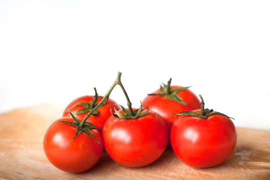 tomatoes in the kitchen isolated on white