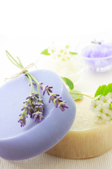 Obraz na płótnie Canvas Handmade soap with lavenders and white flowers