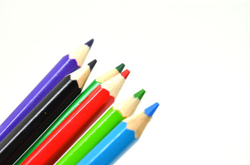 Fototapeta premium color pencils on white background with a space for text