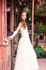 Charming little girl in a beautiful dress outdoor