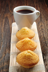 Three cupcake and cup of coffee