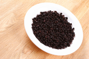 Dark Raisins in a Plate