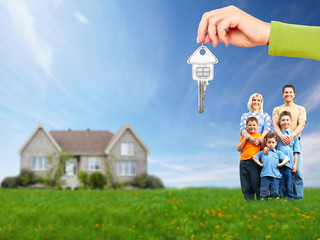 Happy family near new house.