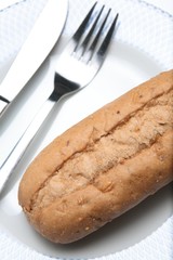 Wholewheat bun with utensils