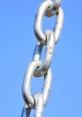 Fototapeta premium Chain Links - Shows a closeup of a metal chain link segment from