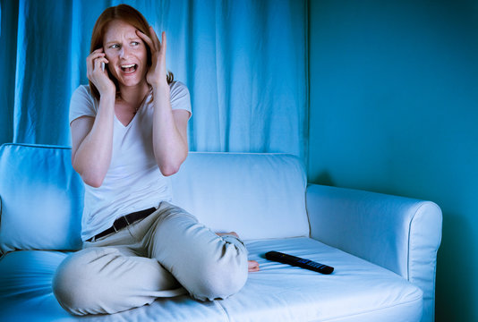 Woman On The Phone While Watching TV