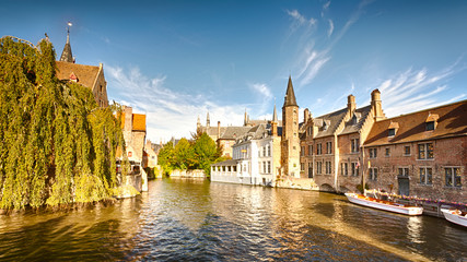 A wide water canal with old buildings