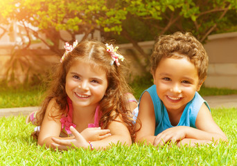 Happy kids on green grass