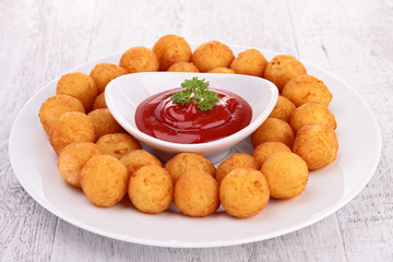 dauphine potato and ketchup