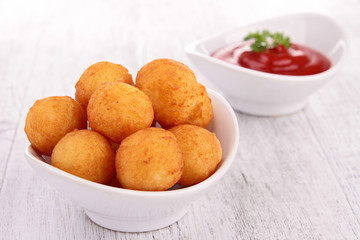 dauphine potato and ketchup