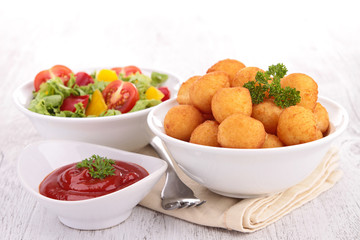 dauphine potato and ketchup