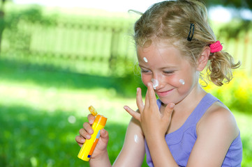smiling girl with suncream