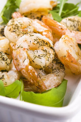 Fresh grilled shrimps on white plate