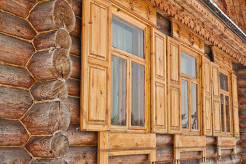 Three windows of old wooden house