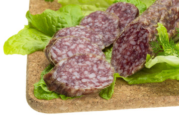 Salami with rosemary, salad and tomatoes