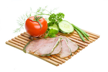 Ripe fresh ham with vegetables