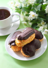 Eclairs with cream in chocolate coating