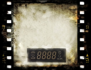 Obraz premium blank old grunge film strip frame with dvd digital clock