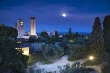 San Gimignano night, medieval town landmark in moon light, tower - obrazy, fototapety, plakaty