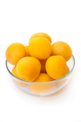 Ripe apricots in glass bowl, selective focus