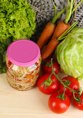 Fresh vegetables and canned on table close up